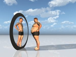 optimized-bigstock-man-sees-other-self-in-mirror-21683519